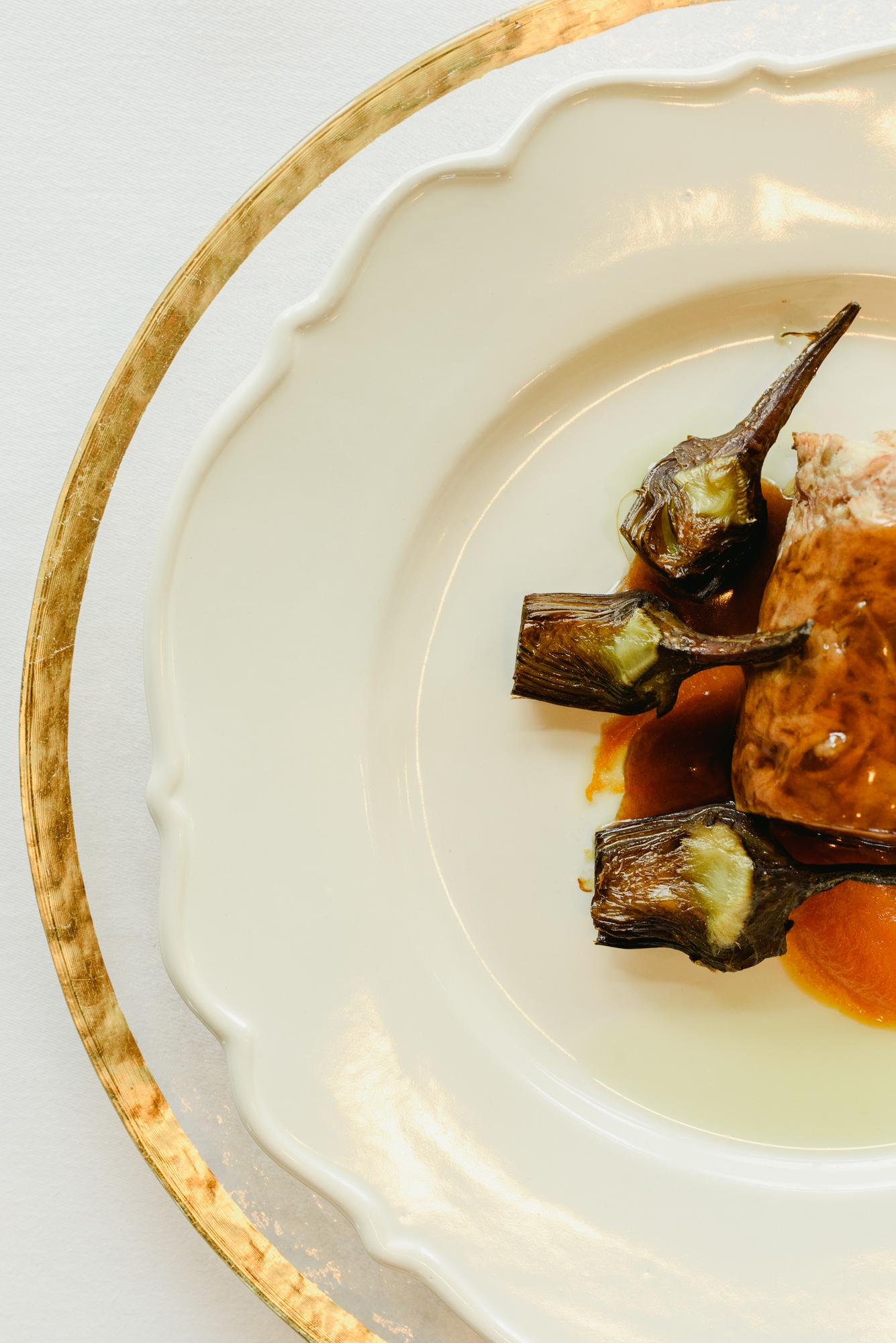 Large editorial: plated tasting menu on a textured plate